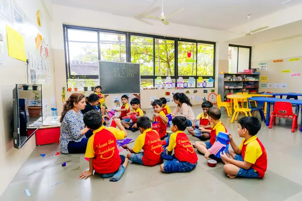 A classroom with a teacher and students engaged in an activity